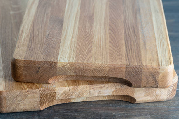 istock Two wooden cutting board on wooden table background 1309620658