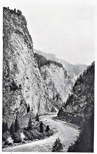 Via Mala, Switzerland Entrance, European Geography
The Via Mala Gorge lies between Thusis and Andeer, Switzerland, and was carved into the massive rocks by glacial ice and the water of the Rhine River. (German Rhein, French Rhin, Dutch Rijn, Celtic Renos, Latin Rhenus River.) Illustrations published in The Rhine: From Its Source to the Sea translated by G.C. T. Bartley from the German authors Karl Stieler, H. Wachenhusen, and F. W. Hacklander. (Henry T. Coates & Co., Philadelphia) in 1898.  Copyright has expired and is in Public Domain.