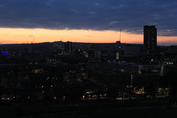 istock sunset and dark city view 1309624277