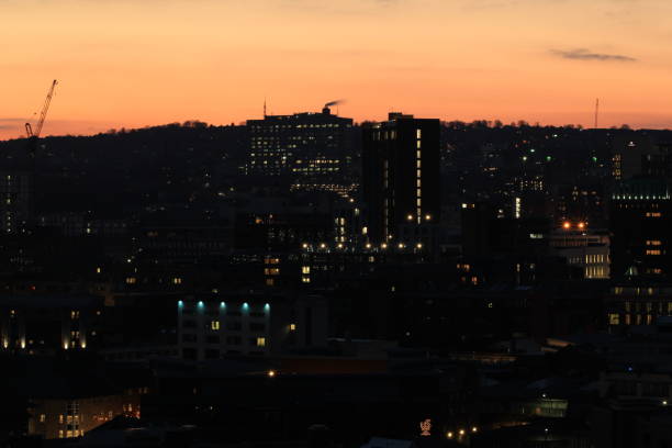 istock sunset and dark city view 1309624280
