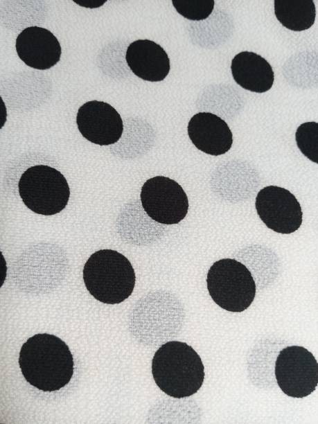 istock colored dot crepe fabric in shades of black and white 1309624672