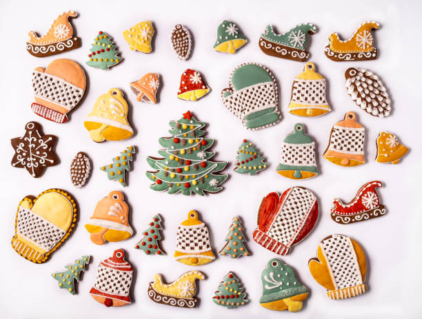 istock Festive Christmas and new year decorations with gift boxes and gingerbreads on white  background 1309625331