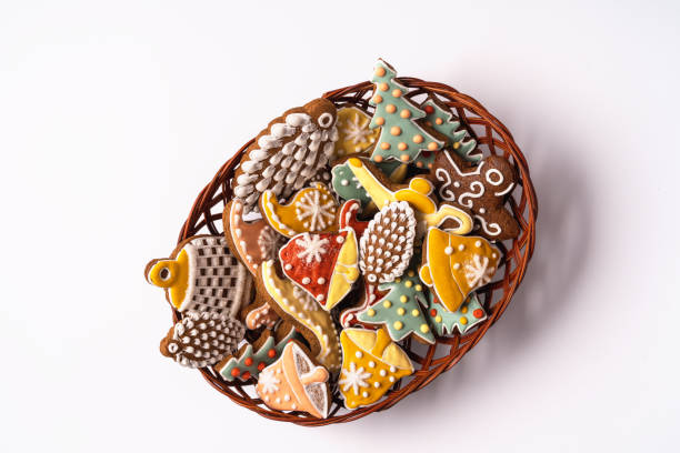 Festive Christmas and new year decorations with gift boxes and gingerbreads on white  background