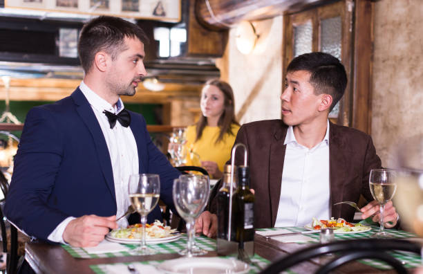 istock Two businessmen are having dinner in the restaurante 1309627010