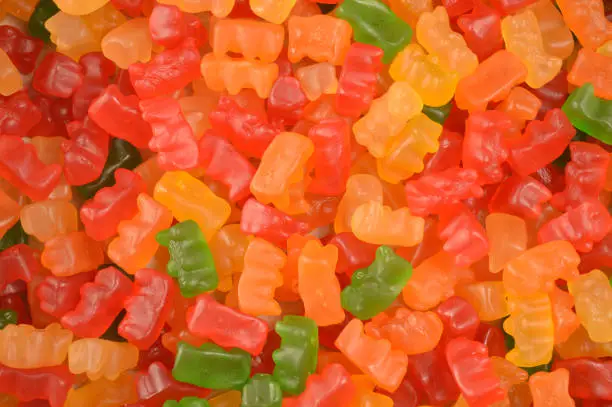 A full frame of gummy bears to create a tasteful background image.