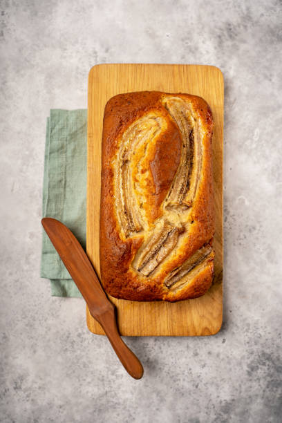 istock Homemade banana bread on wood board 1309634529