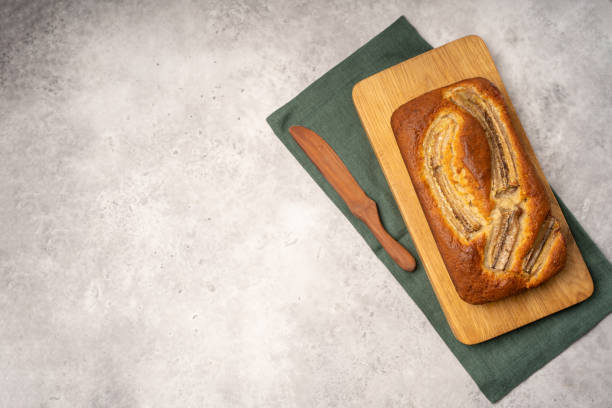 istock Homemade banana bread on wood board 1309634543