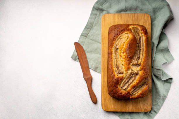 istock Homemade banana bread on wood board 1309634545