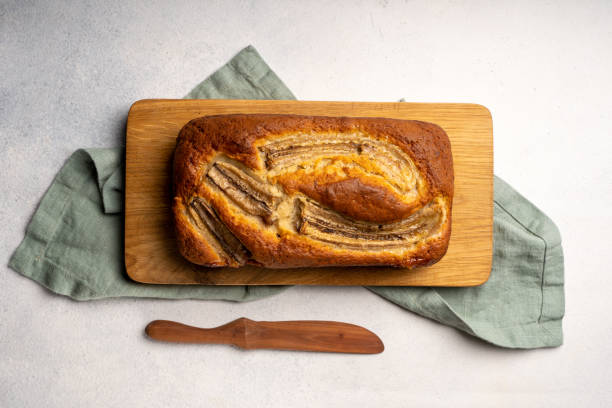 istock Homemade banana bread on wood board 1309634629