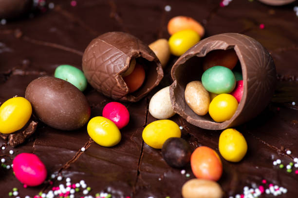 istock Chocolate Easter eggs on top of a chocolate cake dessert closeup 1309636485