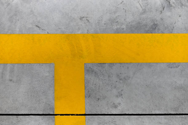 detail of yellow lines on a concrete floor delimiting a parking place