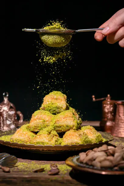 Photo of Traditional Turkish Ramadan dessert - baklava with pistachios (Turkish: fistikli baklava). Eid mubarak. Ramadan kareem.