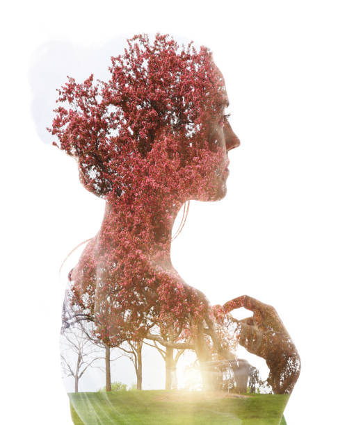istock Multiple Exposure of woman and apple blossoms 1309642871