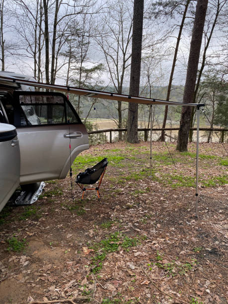 istock Overlanding campsite with awning on river bluff 1309642921