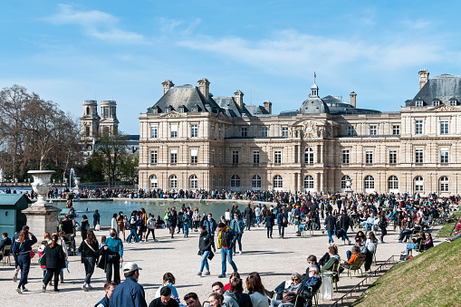 Jardin du Luxembourg crowded of people despite of covid 19 pandemic. Paris in France, Luxembourg quarter. March 28, 2021.