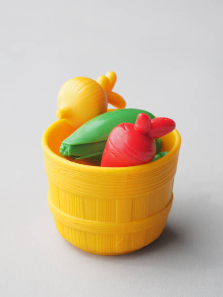 istock Colorful Plastic Vegetables in Wicker Basket. 1309646717