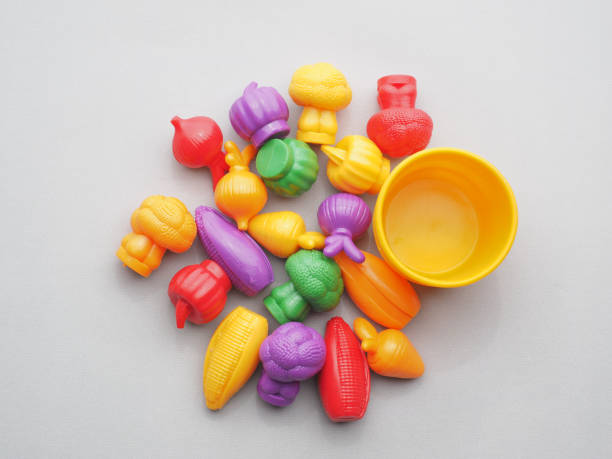 istock Plastic toys vegetables with empty basket. Top view. 1309646736