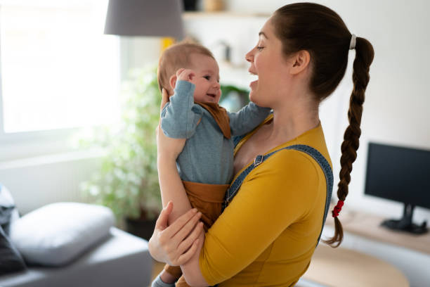 istock Mother having fun with her baby boy at home 1309647694