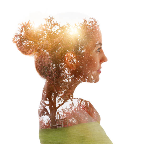 istock Multiple Exposure of woman and apple blossoms 1309648781