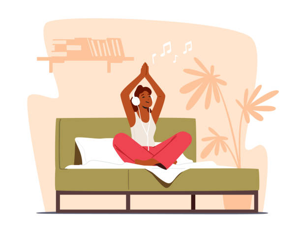 静かな女性瞑想は、ベッドの上に頭とヘッドフォンの上に手で蓮の姿勢で座ります。モーニングヨガの練習 - lotus position audio点のイラスト素材／クリップアート素材／マンガ素材／アイコン素材
