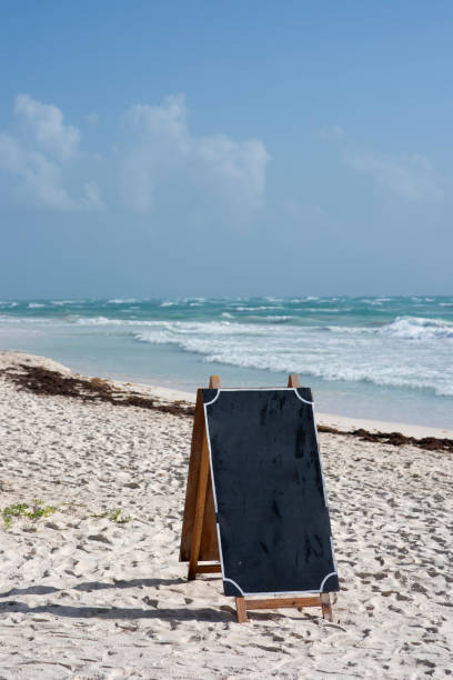 istock Blank blackboard on beautiful Caribbean beach at Tulum Mexico 1309651534
