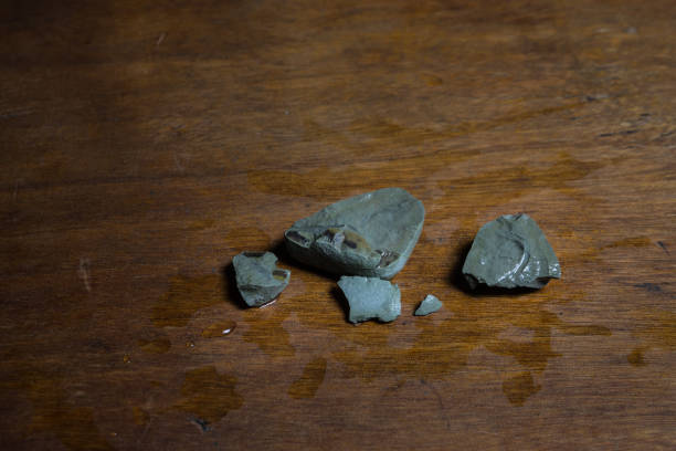 istock Pyramid of sea pebbles on a wooden table . Selective focus 1309659663