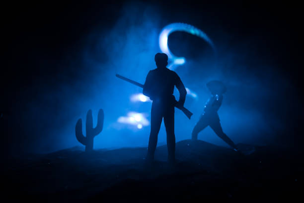 istock Western cowboy silhouette with texture at sunset and slivers of light 1309659717