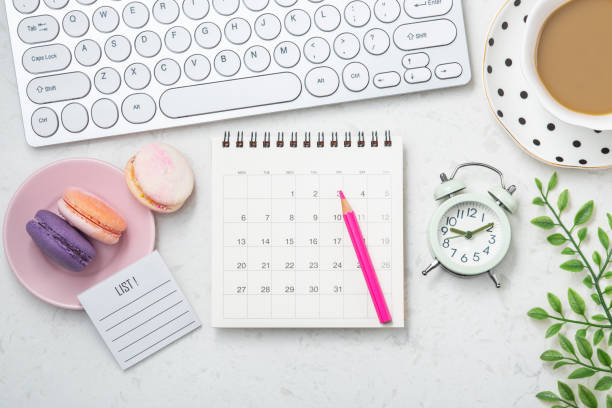 istock Office desk with calendar, computer keyboard and coffee cup 1309668591