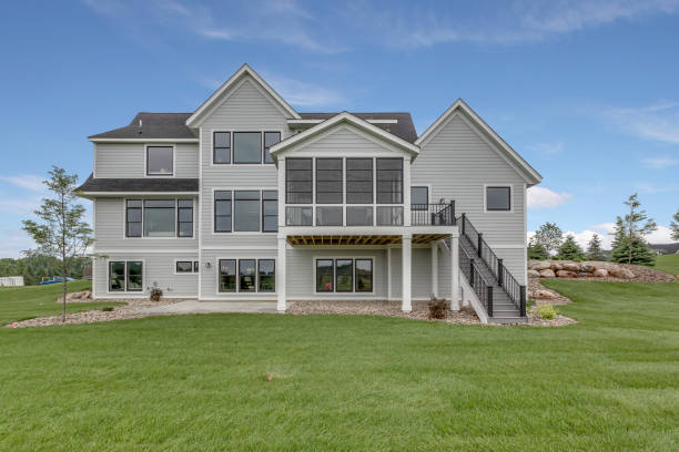istock Rear view of gorgeous home with sun room deck 1309668876
