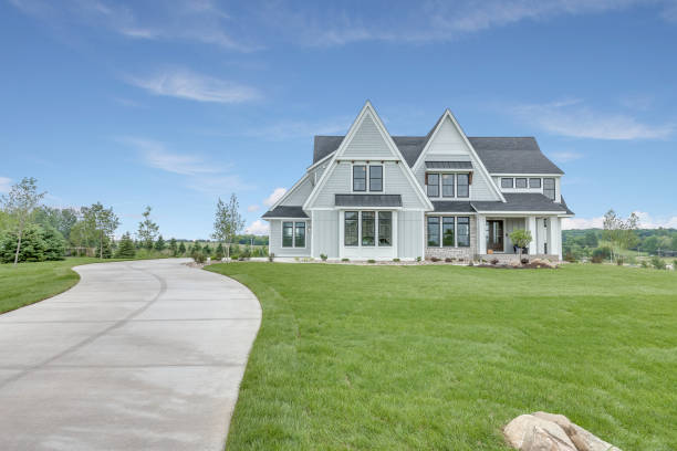 istock New home on a large lot with a long driveway 1309668918