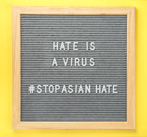 istock Letter board with quote hate is a virus and hashtag stop Asian hate 1309675524