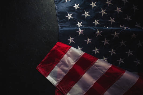 istock USA Flag on dark background 1309675814