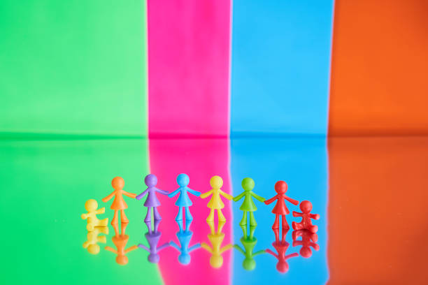 A plush bear is silhouetted against sheer curtains, sitting on a textured surface with soft natural light casting shadows