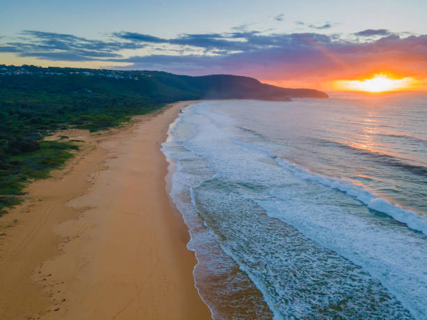 istock Aerial sunrise seascape with waves and clouds 1309678715