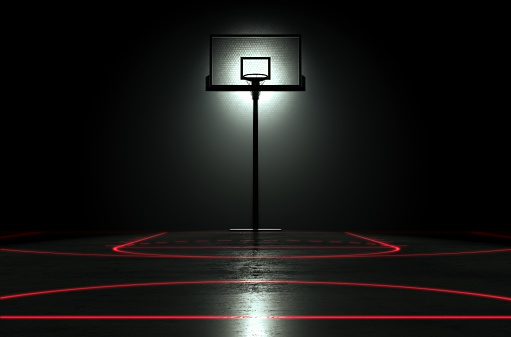 A concept showing a hoop on a reflective concrete basketball court with illuminated red lines backlit by a single honeycomb spotlight - 3D render