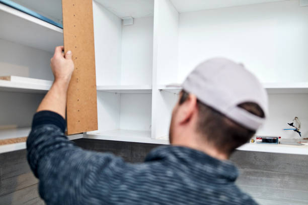 istock Handyman worker assembling furniture and fixing it. 1309683199
