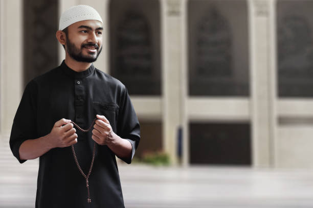 istock Religious asian muslim man holding prayer beads beads 1309684062