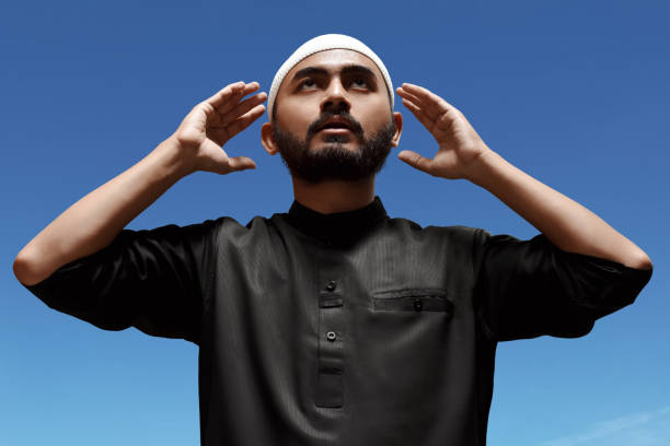 istock Religious asian muslim man praying 1309684106