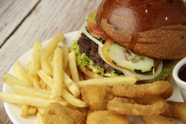 istock Freshly made giant hamburger sandwich with cheese and vegetables 1309688218