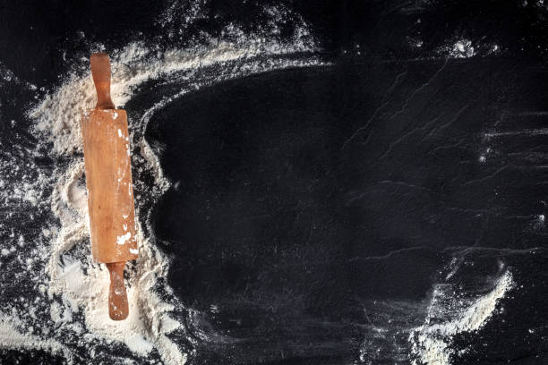 istock Baking background with a rolling pin and white flour, shot from the top 1309688763