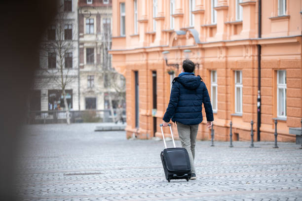 istock Man wearing a mask while traveling in the city 1309693304