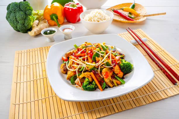 istock sweet and sour chicken with rice and vegetables 1309696001