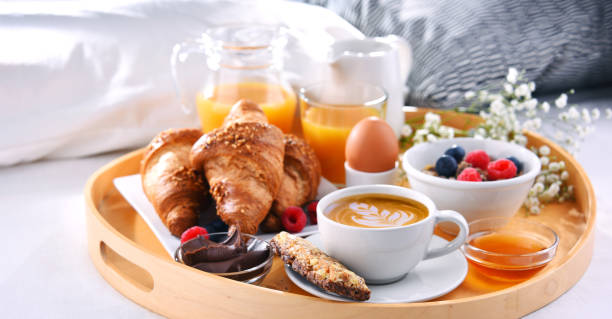 istock A tray with breakfast on a bed in a hotel room 1309696091