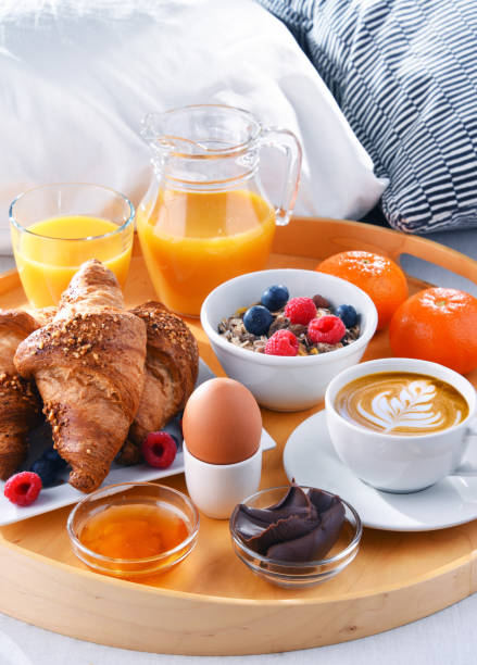 istock A tray with breakfast on a bed in a hotel room 1309696165