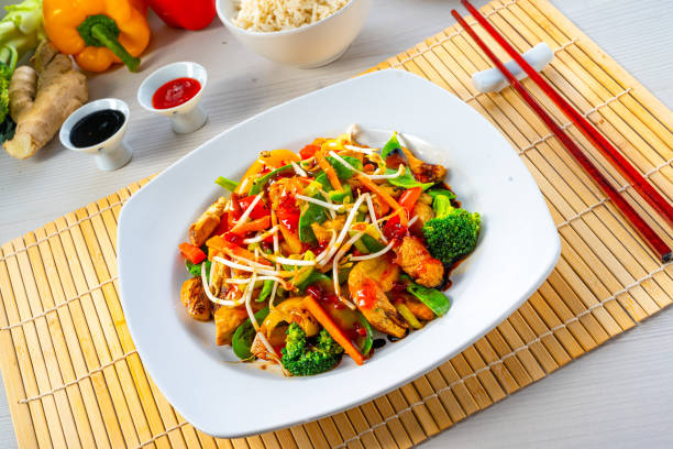 istock sweet and sour chicken with rice and vegetables 1309696431