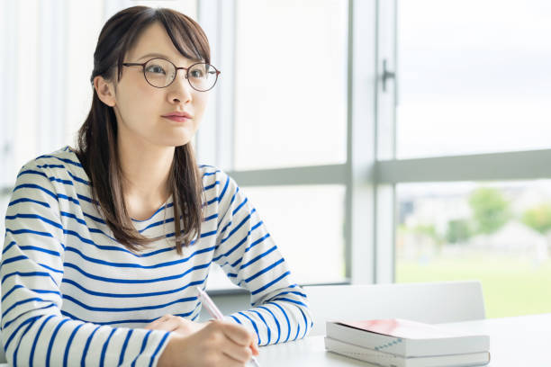 istock Young asian female high school student taking classes. 1309697336