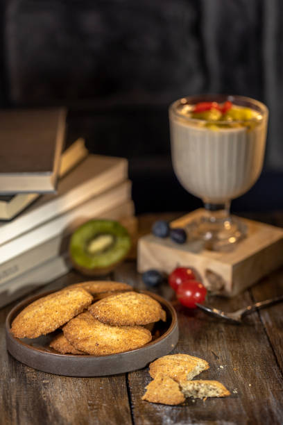 istock wholewheat cookies, yogurt and books on table 1309697505