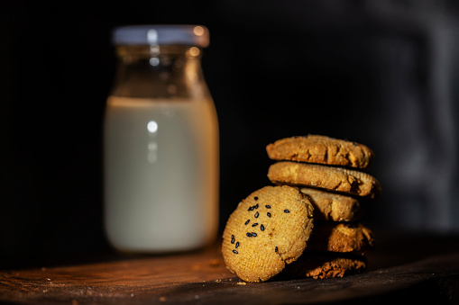 handmade cookie and milk bottle on table
