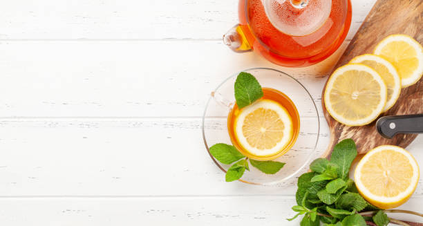 istock Herbal tea with mint and lemon. Tea cup and teapot 1309697667