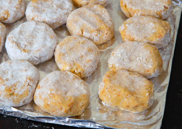 istock Frozen vegetable cutlets on the board. Cutlets for a vegetarian burger 1309697673